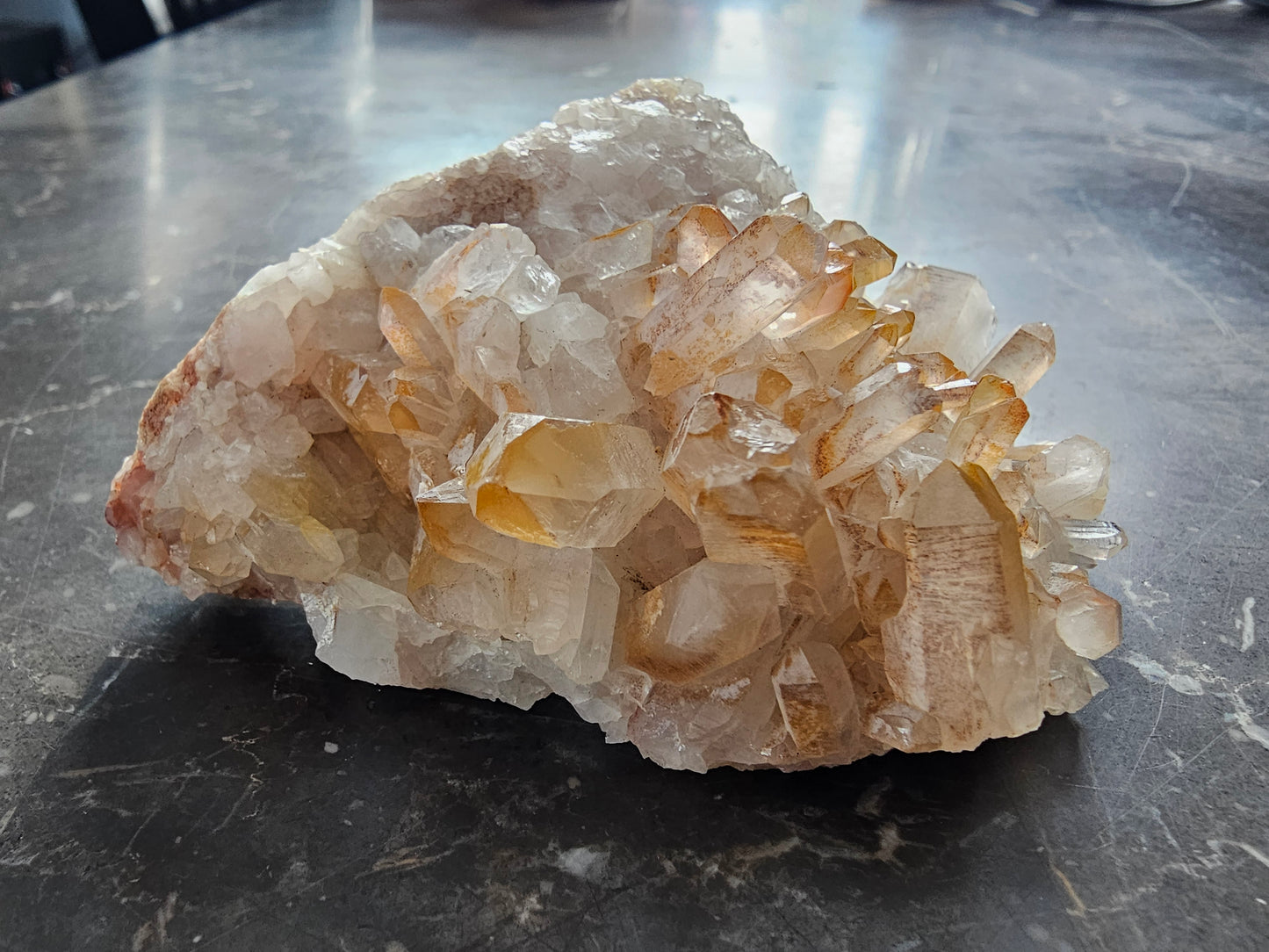 Quartz Cluster w Golden Healer Skull Carving on Matrix
