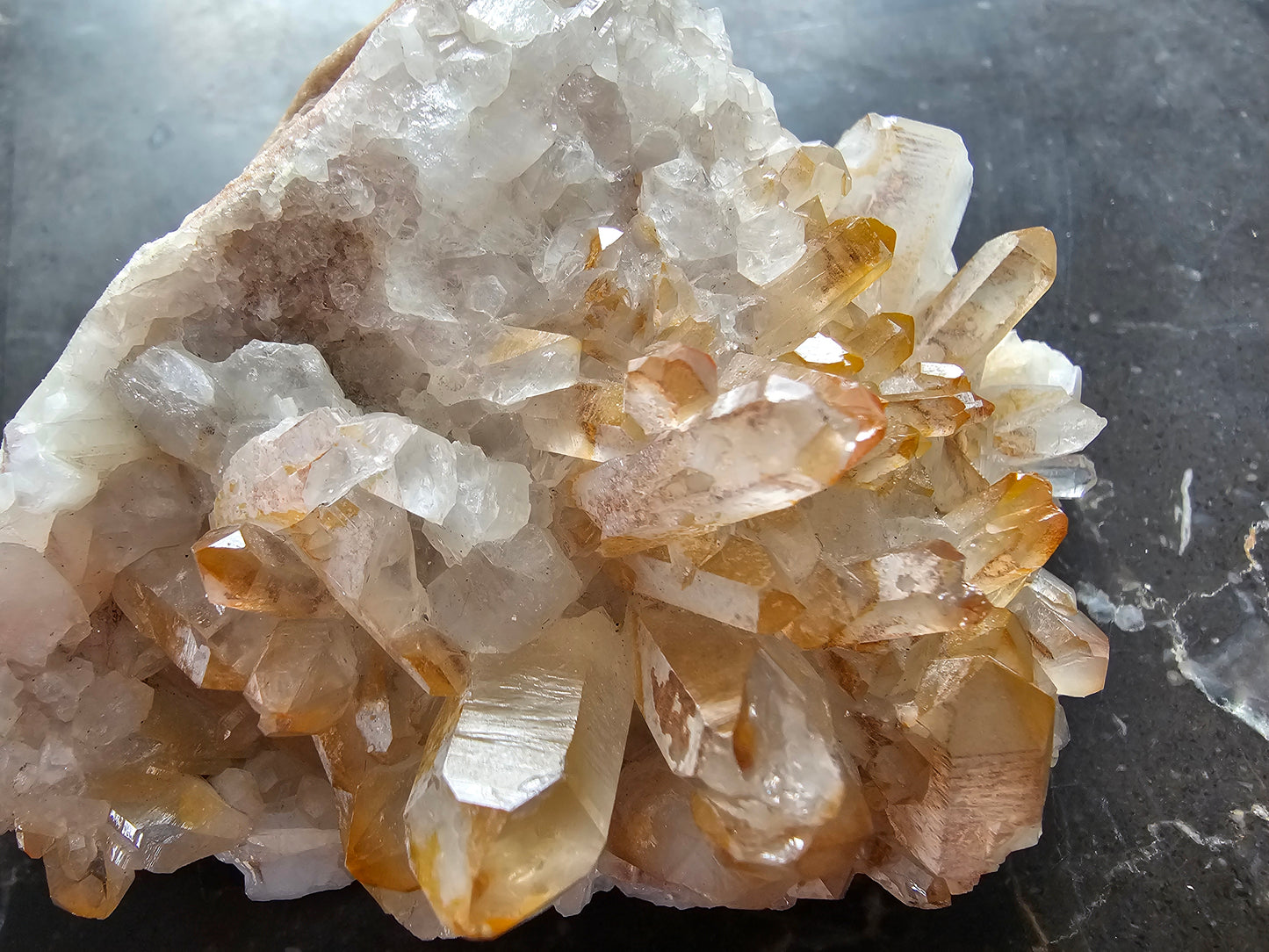 Quartz Cluster w Golden Healer Skull Carving on Matrix