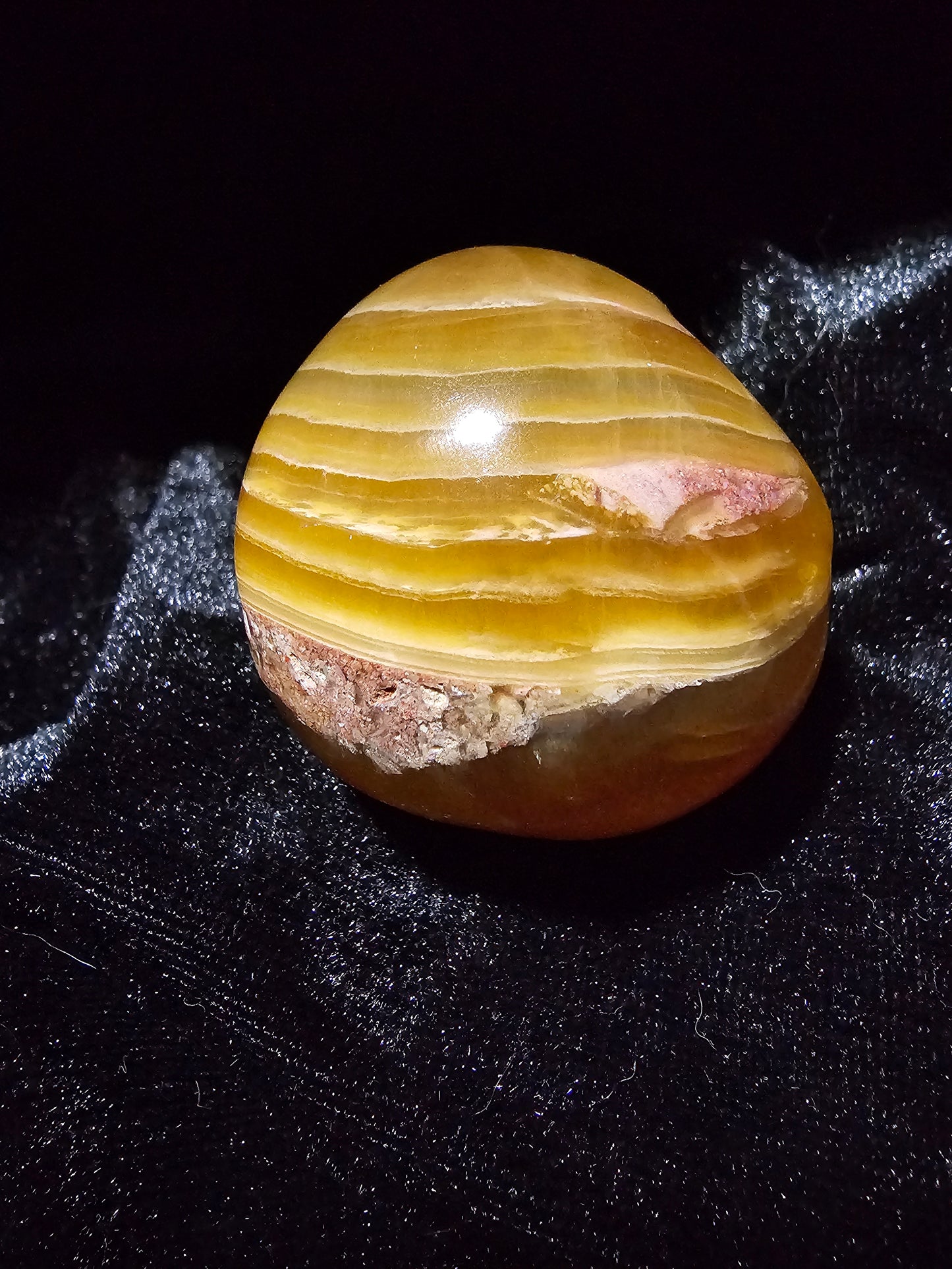 Calavera de niño estrella de fluorita dorada de Leandro