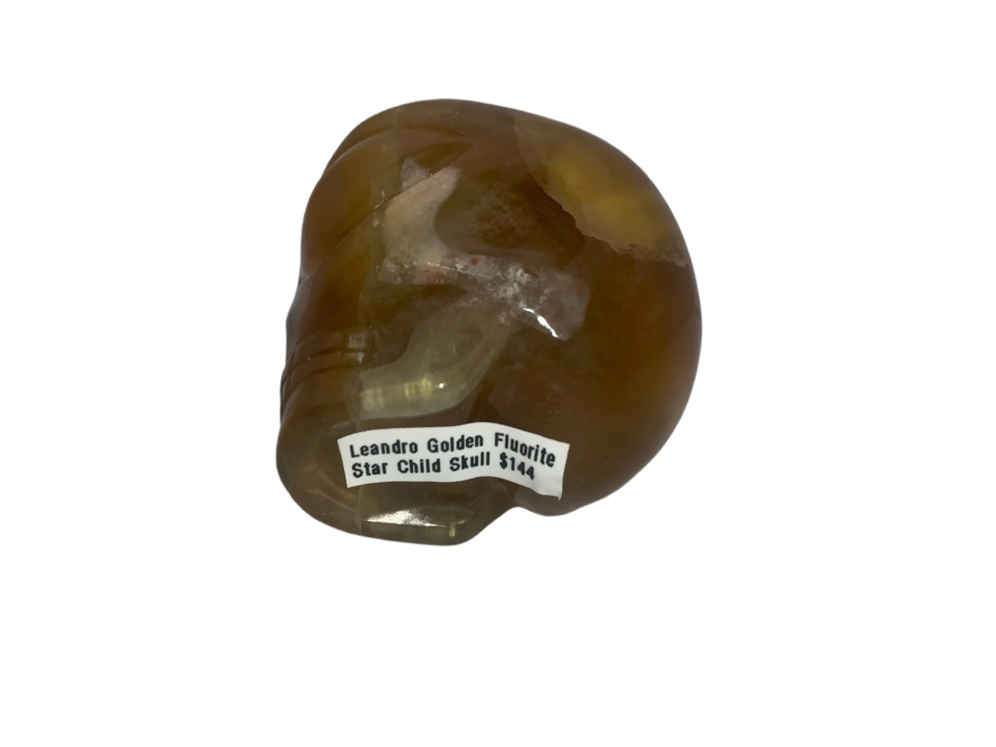 Calavera de niño estrella de fluorita dorada de Leandro
