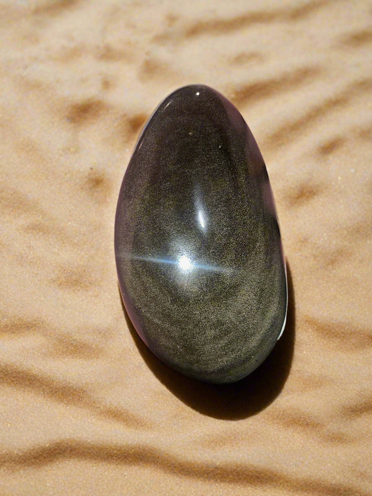 Piedra de palma de obsidiana con brillo dorado