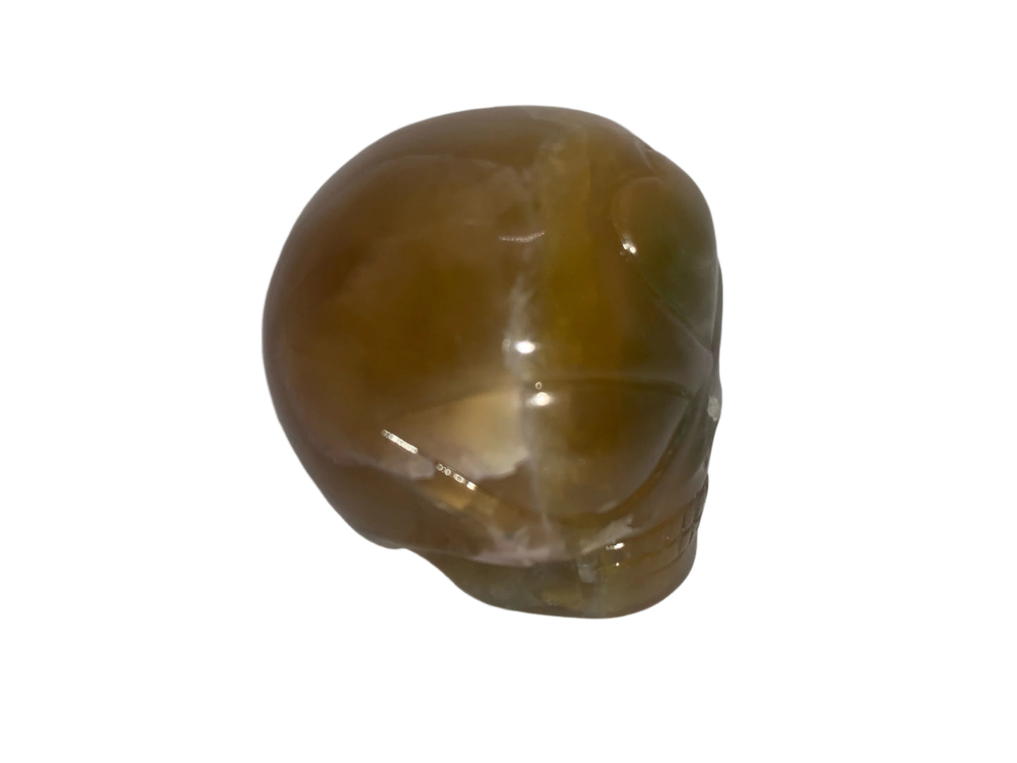 Calavera de niño estrella de fluorita dorada de Leandro